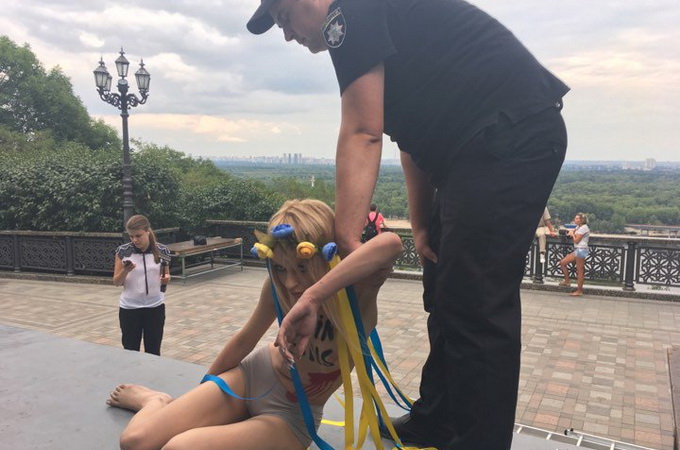 Femen activist insults on the monument to Holy Prince Vladimir