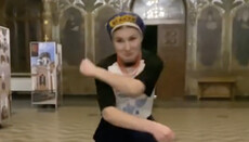 A girl in Ukrainian costume dances in the Refectory Church of the Lavra