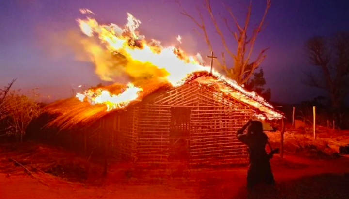 A burning Christian church in one of the villages in northern Mozambique attacked by ISIS-linked militants. Photo: MEMRI